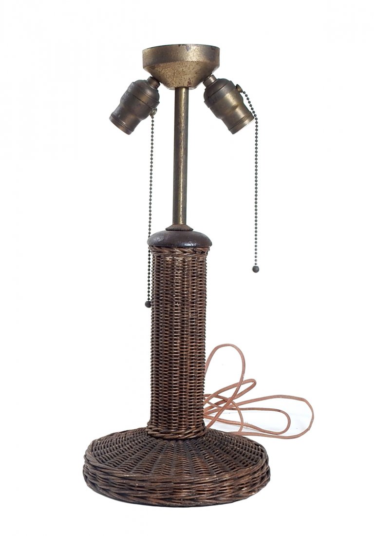 Two-Light Rattan Table Lamp: Two-light rattan table lamp with rounded base. [19 1/2" H]. Wiring not tested. Some wear along the base.