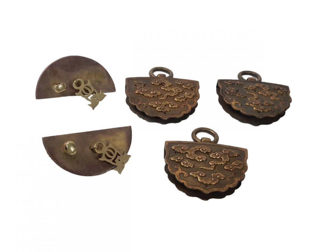 Five Pieces Chinese Bronze Fittings: Three Chinese bronze fittings for panel or door and two Chinese bronze door handles. [5" x 4"]. Good condition. From the Estate of Charles Lamb.