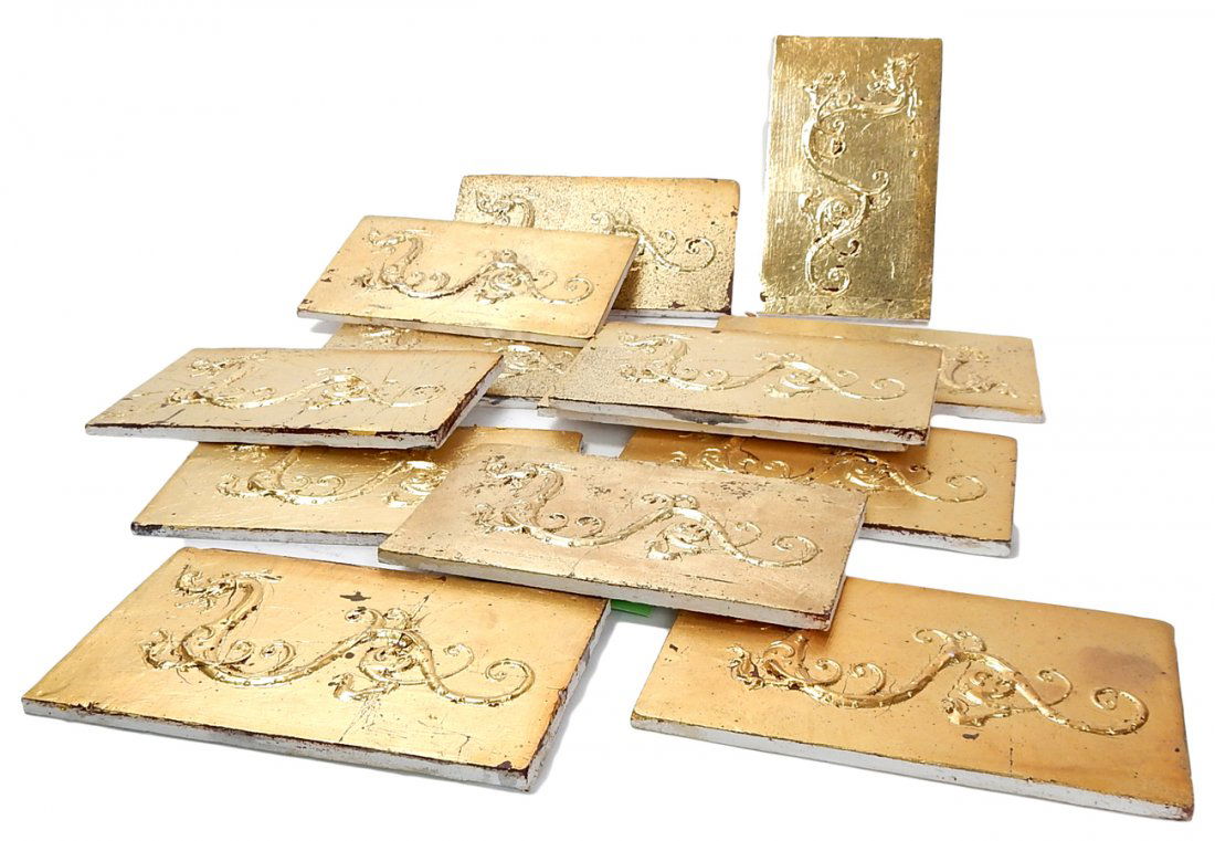 13 Plaster Cast Plaques: 13 gold leafed plaster cast plaques of Chinese dragons. [4 1/2" W x 1/4" D x 7 3/4" H]. In good condition. From the Estate of Charles Lamb.