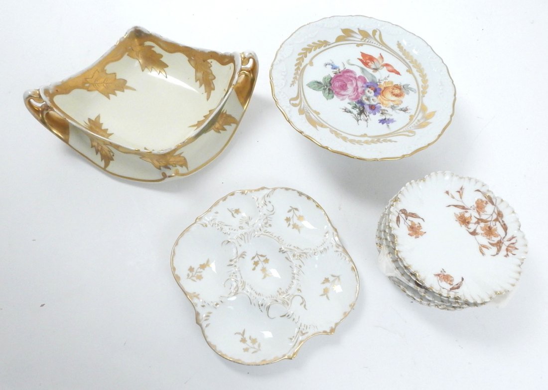 Assembly of 11 Limoges Articles: Assembly of 11 porcelain Limoges china comprising: 1 Limoges marked cake stand, 8 Limoges dessert plates, 1 Limoges two-handled serving bowl and 1 unmarked oyster plate. [Cake stand: 9 1/4" dia x 3 1/