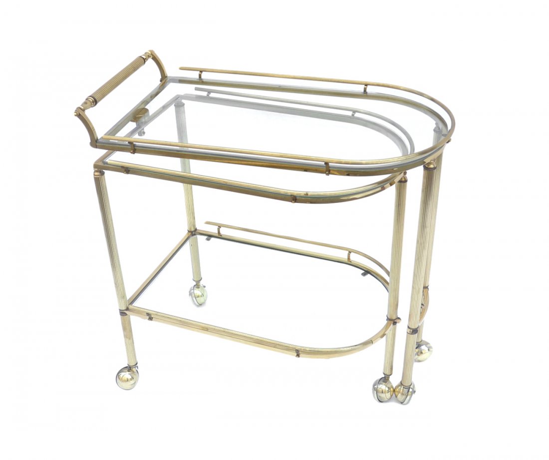 Brass Tea Cart: Brass tea cart on rollers with fold-out second tier with glass shelves. [31" W x 16 1/4" D x 31" H]. Overall good condition.