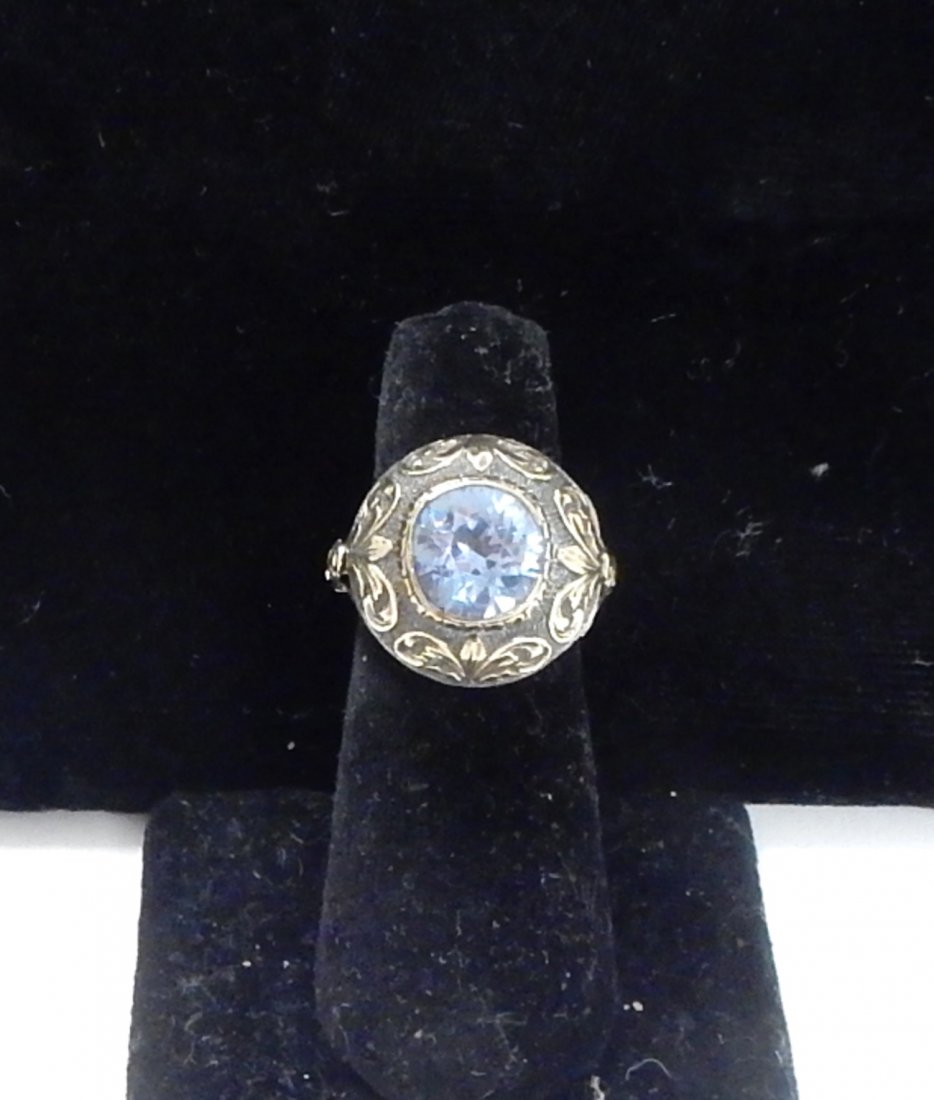 Silver Gilt Poison Ring: Victorian silver gilt poison ring with faceted blue spinel scroll leaf motif.