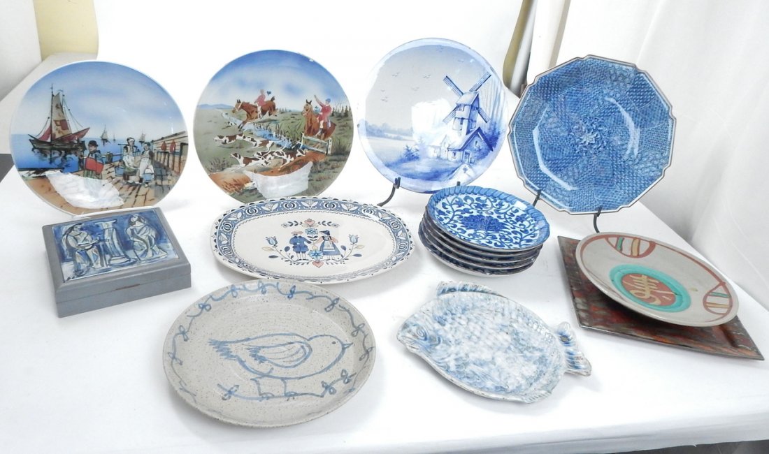 10+ Plates - Scenic, Asian & Stoneware: Comprising of two German figurative plates, a Dutch windmill, blue and white six Asian plates, a platter, stoneware plates, a porcelain tile box and a fish plate. [Plates: 12" Dia; 28 3/4"; Platter: 1