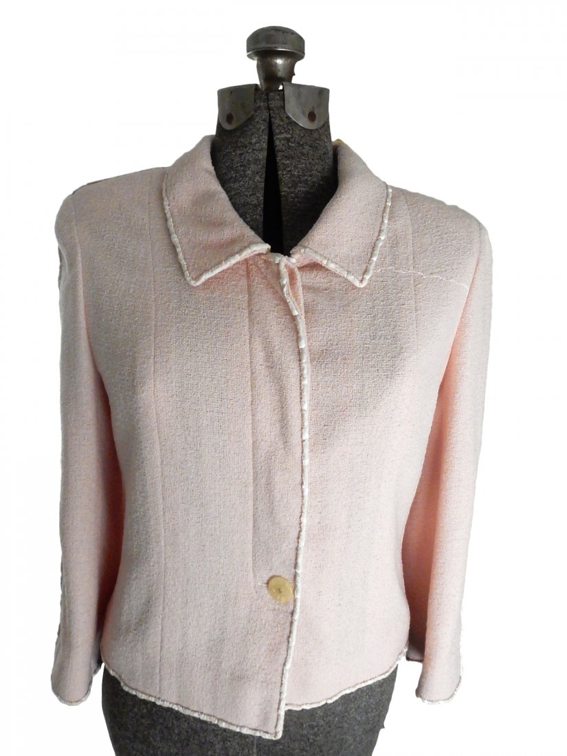 Pink Chanel Jacket: Pink Chanel jacket with white outline. Bears Chanel label. Size 40. All buttons intact.