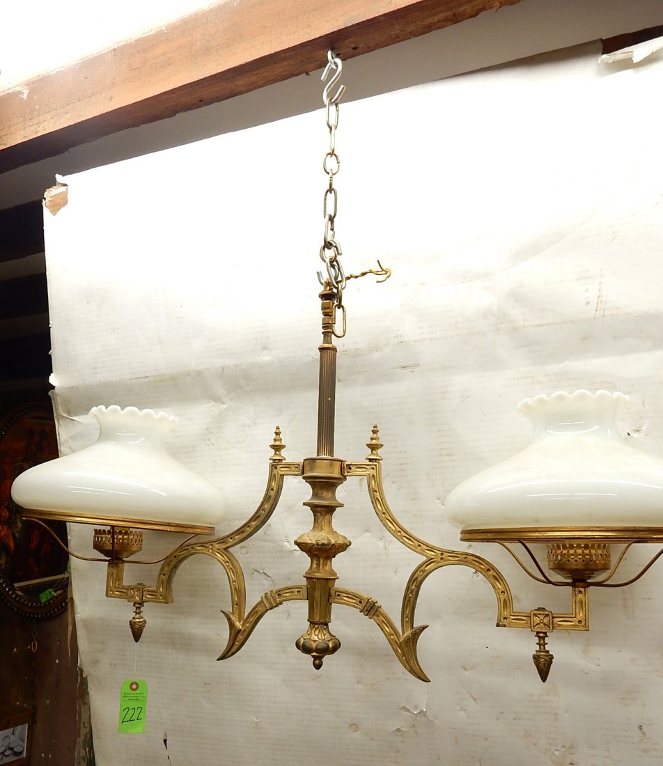Large Bronze Light Fixture: Ornate neoclassical bronze two-light fixture. [40 1/4" W x 21" H]. Shades included. Wiring not tested, wear to bronze, otherwise in good condition.