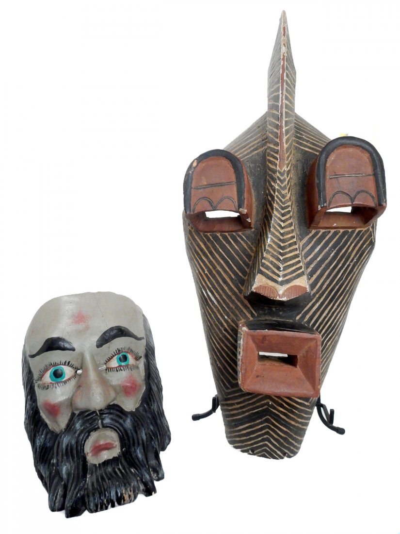 Two Wood Masks: Wood carved African painted mask and another beaded mask. [24" x 10" and 11" x 7 1/4"]. Some paint loss and split in bearded mask.