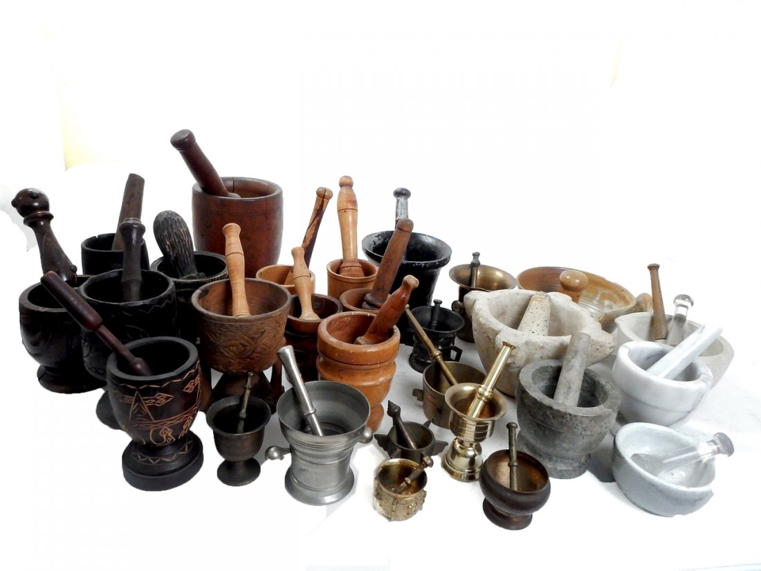 45 Mortars and Pestles: Comprises: 45 various sizes of mortars and pestles- 24 wood, 13 metal, 1 glass, brass and bronze, 4 hardstone, 2 porcelain and one ceramic ironstone. [1 1/2" H to 7 1/2" H]. In good condition.