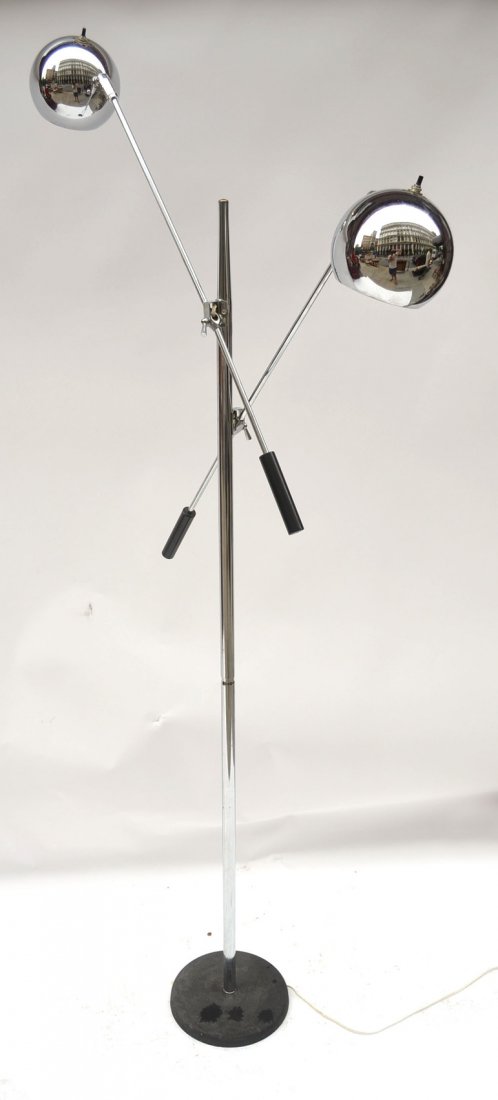 Manner of Modern Arteluce Floor Lamp: In the manner of Arteluce. Modern chrome two light floor lamp on round black base. [61 3/4" H]. Wiring not tested, bears some surface scratches and minor oxidation, otherwise overall good condition.