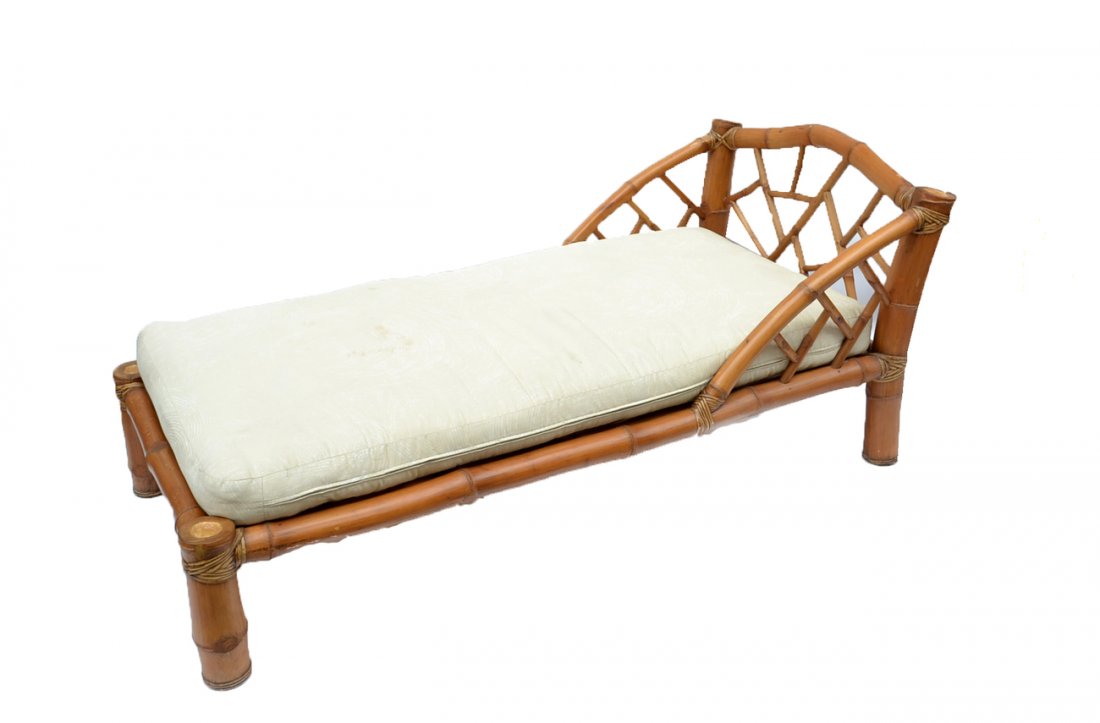 Bamboo Chaise Lounge: Chaise lounge constructed in bamboo, accompanied with matching cushion. [69" W x 36 1/2" D x 31" H]. In good condition.