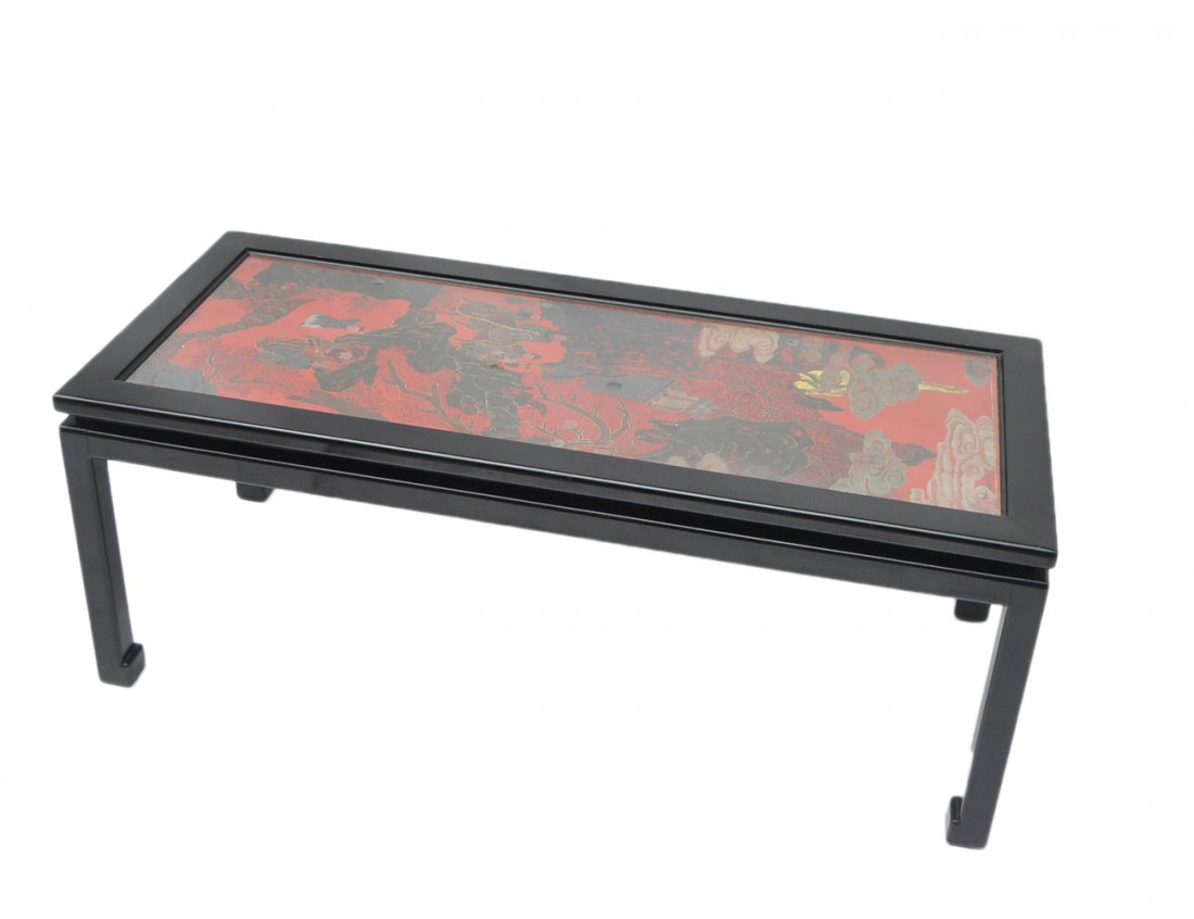 Asian-Style Lacquered Coffee Table: Black lacquered Asian-style coffee table with top decorated with Asian-style ornamentation. [47" W x 20 3/4" D x 18" H].