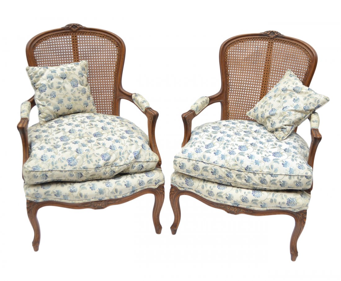 Pair of French Provincial Fauteuils: Each with caned back, fruitwood frames and upholstered seats. [26" W x 38" H (18" H to seat)]. Loose cushion seat and some light wear.