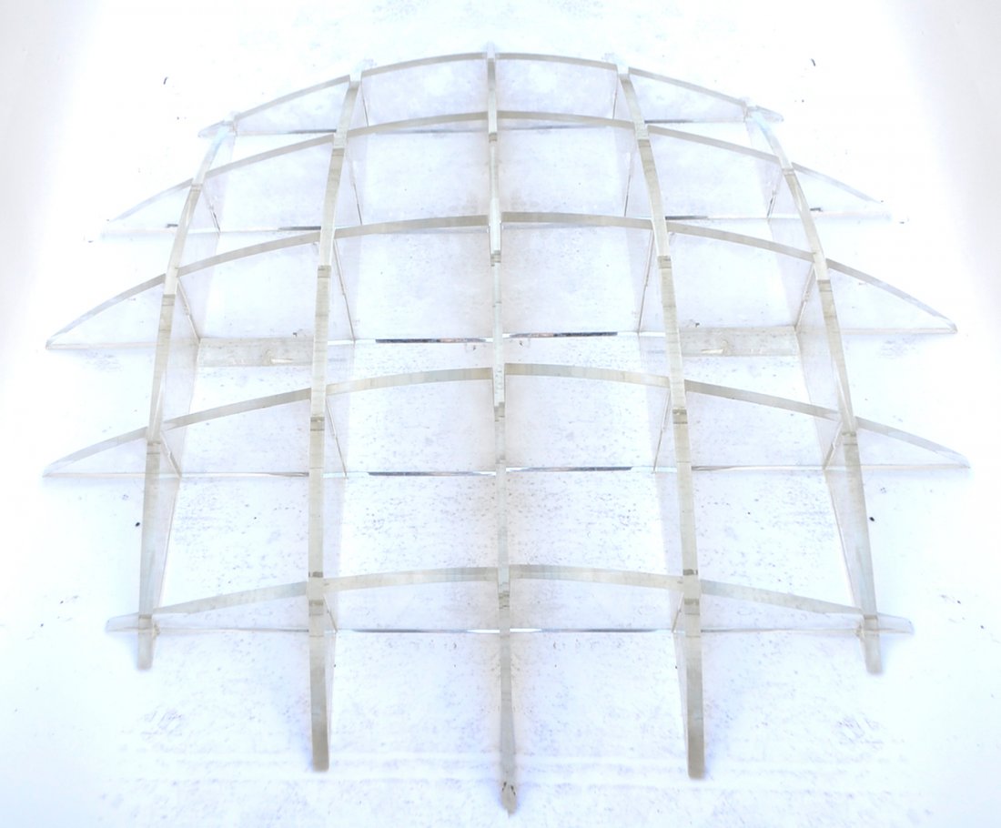 Lucite Wall Etagere: Lucite wall etagere. [60" W x 56" H]. One shelf broken (end).