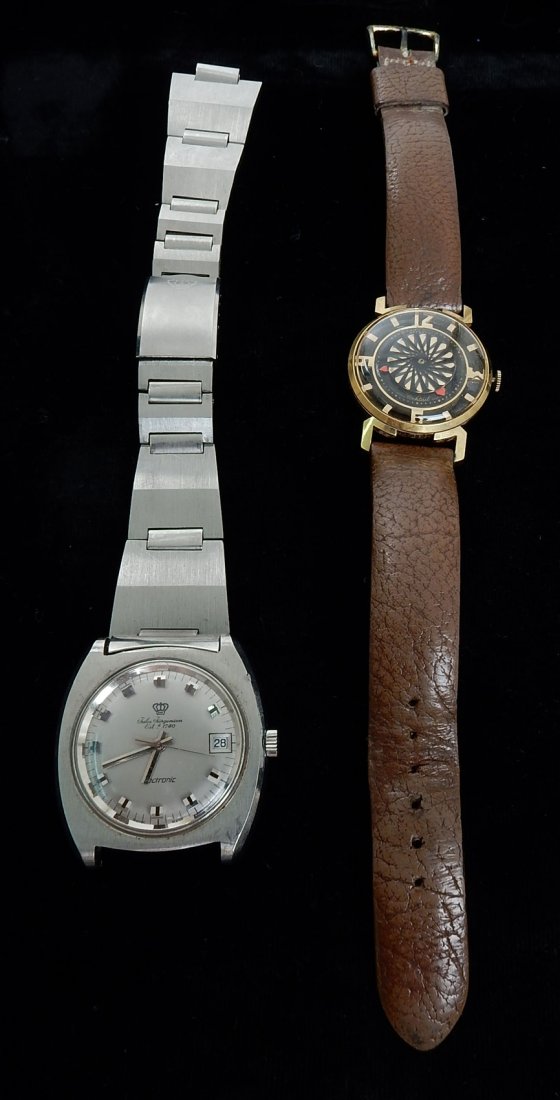 Two Vintage Men's Watches: Two wrist watches comprising: 1.) Jules Jurgensen electronic watch with date display and stainless steel band. 2.) Borel "Cocktail" model watch with crystal front and back on a leather band. Both exhi