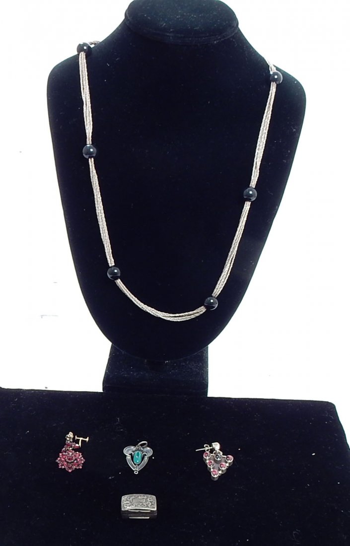 Sterling and Continental Silver Items: Comprises: continental brooch with garnet; single sterling garnet earring; continental silver pill box; 30" strand silver & black bead necklace; single garnet earring.