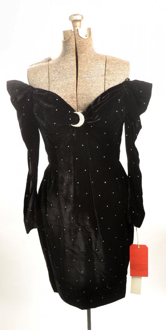 Bob Mackie Black Velvet Cocktail Dress: Bob Mackie cocktail dress in black velvet with small rhinestone ornamentation throughout and a jeweled decoration at bust. Size 8. Style 725x. Special order. New, with tags.