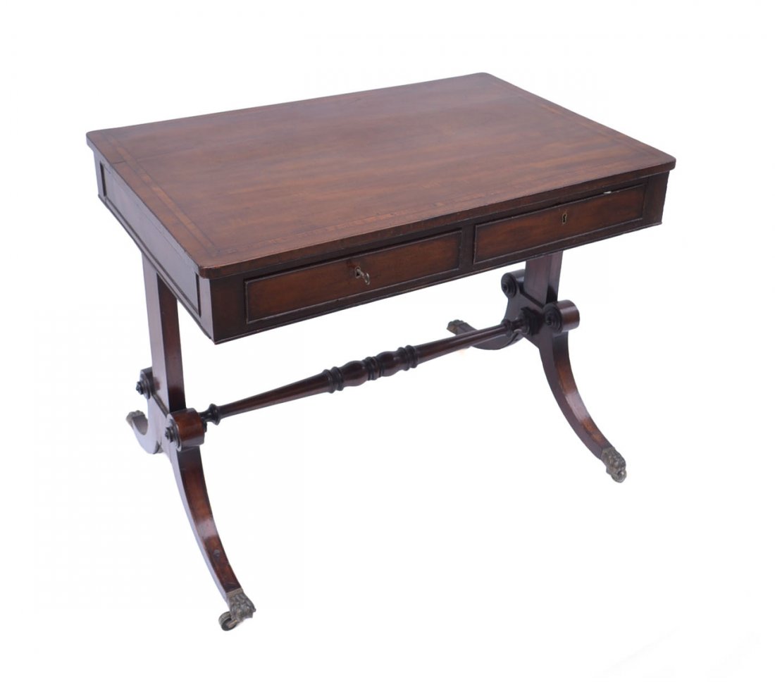Sofa Table: Antique mahogany sofa table with two drawers, inlaid banded top, turned stretchers, and brass claw feet and casters. [36" W x 25" D x 28" H]. Scratches and wear commensurate with age, repair to split 