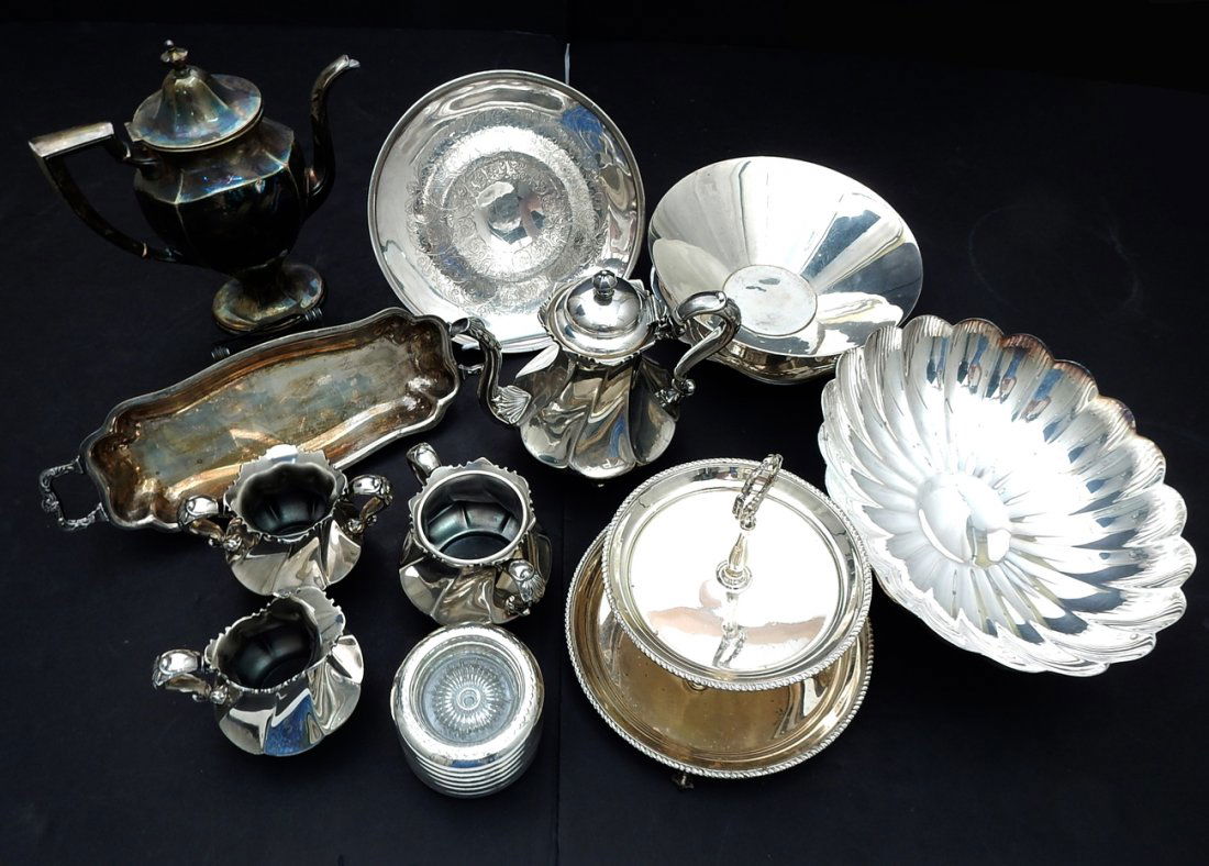 Assorted Silver Plate Articles: Includes: 4-piece silver plate tea set, single urn, 6 glass and silver plate coasters, salt and pepper shakers, among others. 25 pieces.