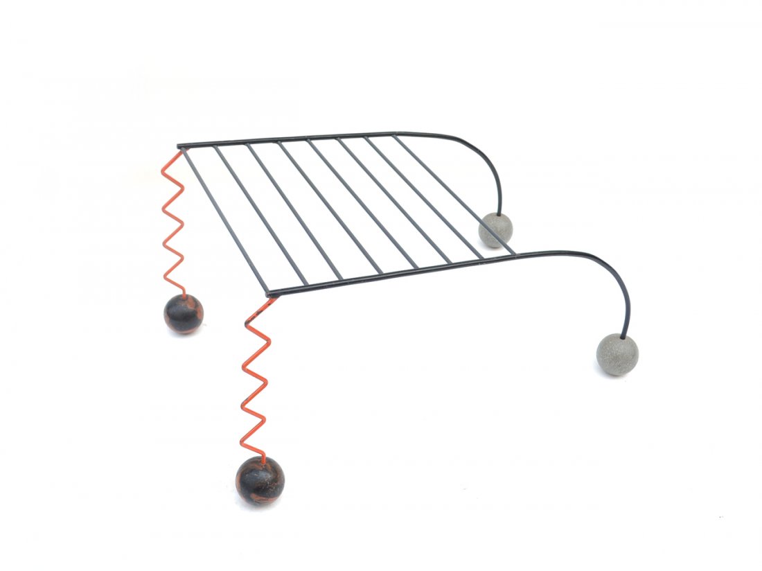 Italian Memphis Magazine Rack: Modern magazine rack with zig zag form orange columns. [15 1/2" H x 29" x 16 3/4"]. Worn.