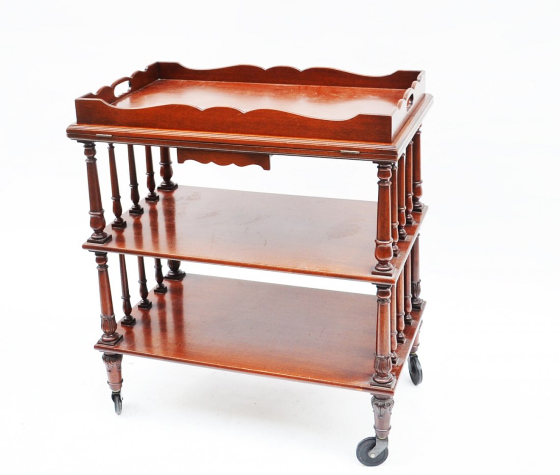 Mahogany Serving Cart: Mahogany 3-tier serving cart with tray top and baluster supports mounted on casters. From the Beacon Hill Collection. [29" W x 18" D x 23" H].
