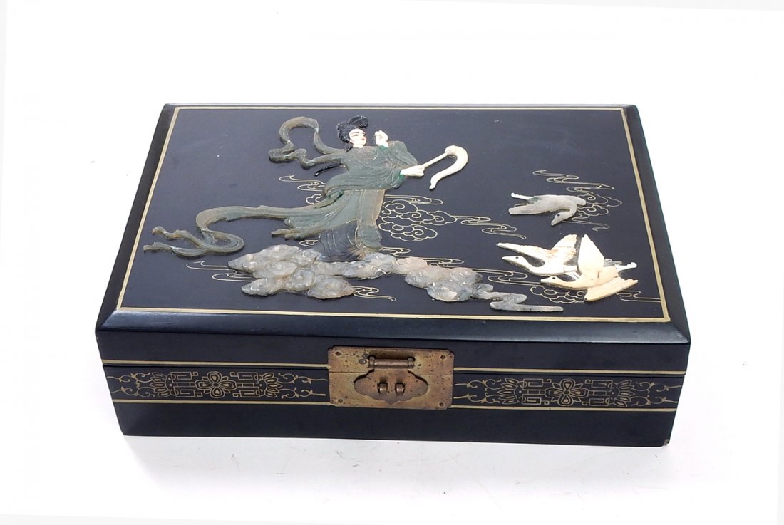 Asian Jewelry Box: Chinese black lacquer jewelry box with female figure and cranes. [12 5/8" L x 8 1/2" W x 3 3/4" H]. Minor chips to lacquer.