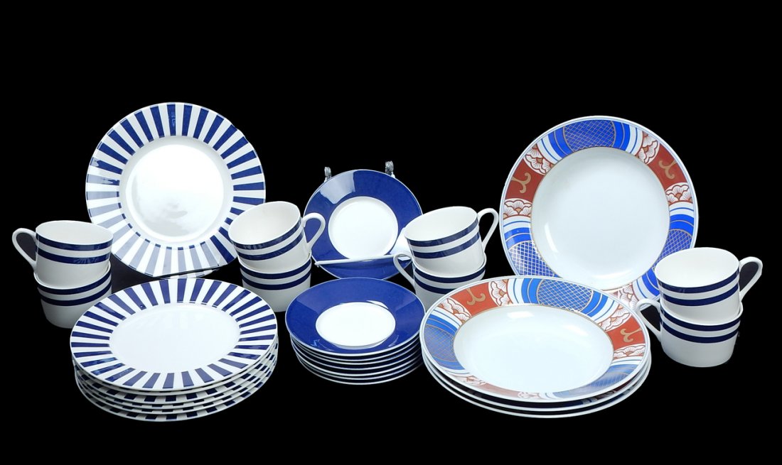 Lot of 27 Porcelain Dishes: Comprises: Mikasa, "Ultima," eight coffee cups and eight saucers: seven luncheon plates, "Mishiki" by Fitz & Floyd; and four soup bowls. In good condition.