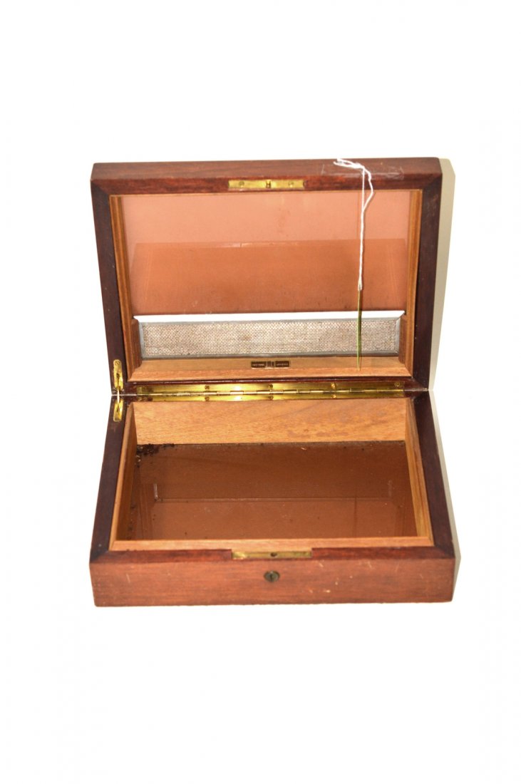 Dunhill Mahogany Humidor: Mahogany humidor labeled "New York, London. Dunhill". No key. [9 1/8" W x 11 3/4" D x 3 3/8" H]. Good condition.