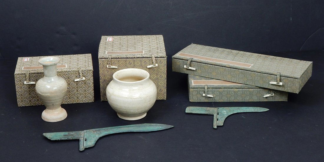 Lot of Four Chinese Replica Items: Comprises: Two bronze blades, axes/halberds in fitted boxes. [8" L and 11 1/2" L]. Two ceramic glazed vessels in fitted boxes. [4" H and 5 3/4" H]. Good condition.