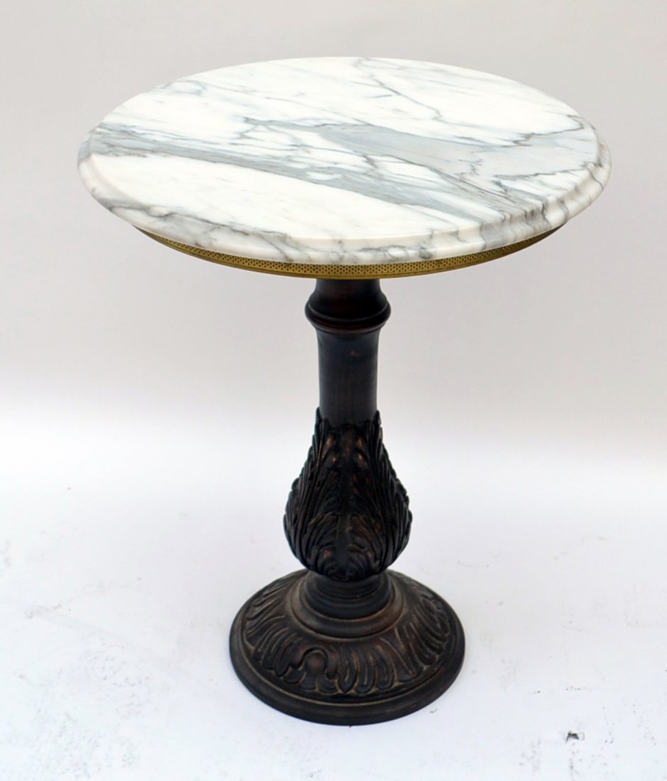 Cast Metal Bistro Table: Round marble top bistro table with a gilt brass ring. [20" dia x 24" H].