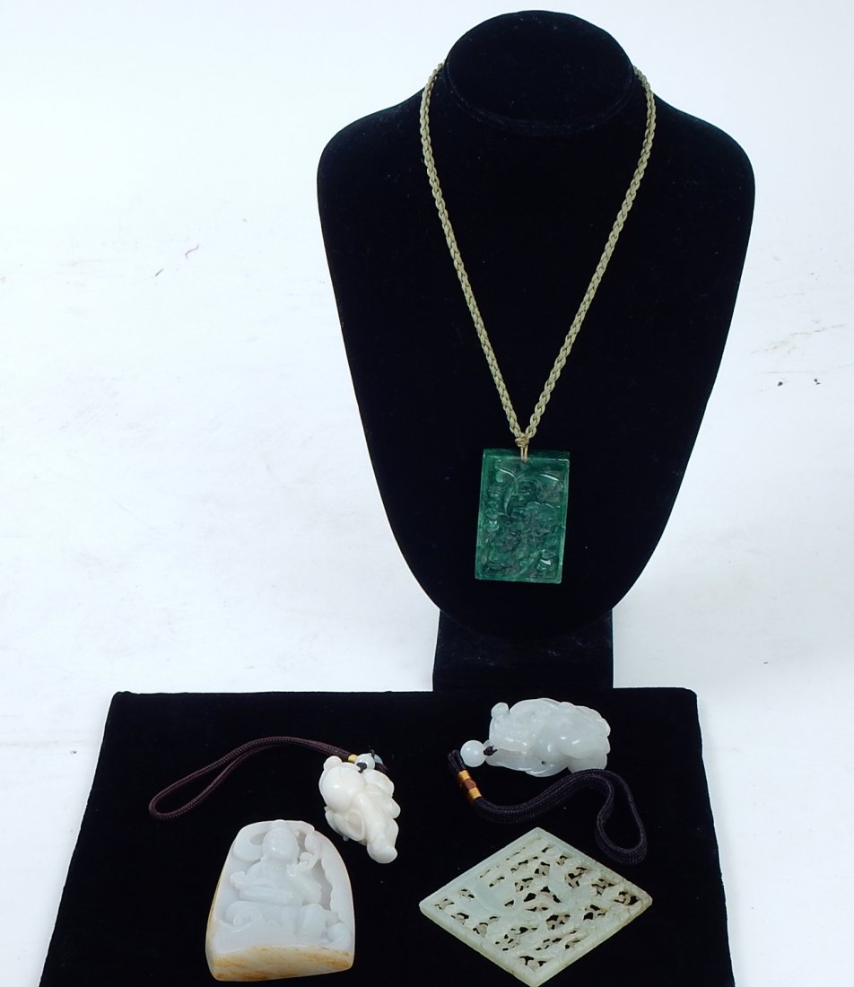 Lot of 5 Jade Pendants & Plaques: Comprises: 1.) Mutton fat jade carving of a foo lion with bead [2 1/2" x 1 3/4" W]; 2.) White jade carved boy with bag and mouse [2 1/4" x 1 1/4"]; 3.) Jade high relief carving of a Buddha [3 1/2" x 2