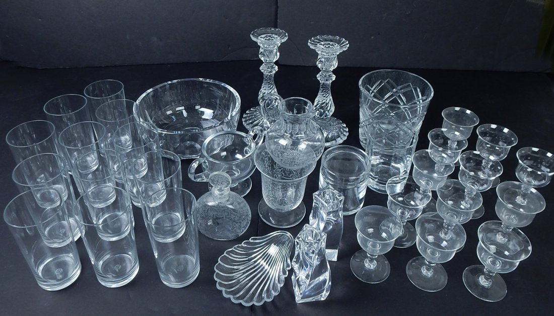 35+ Crystal Baccarat Items& Tiffany: Comprises: Acid etched, signed Baccarat - 12 tumblers, 12 stemmed ports, etched perfume bottle (chipped), large glass, etched beaker, double handled holder, a pair of candlesticks, a covered jar, a Ti