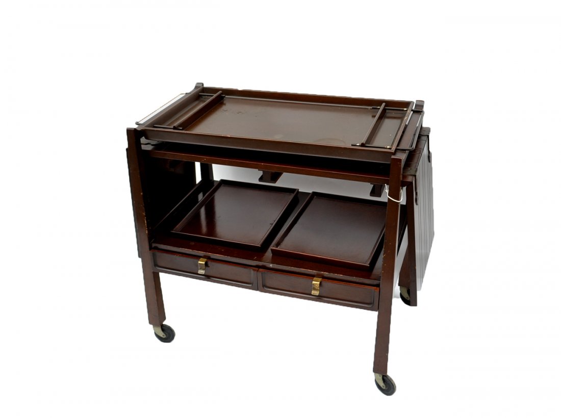 Modern Bar Trolley: Bears three removable tray tops, two drawers, and drop sides. [34 1/2" L x 19" D x 31 1/2" H closed. 67" L x 19" D x 31 1/2" H open.] Scratches throughout.