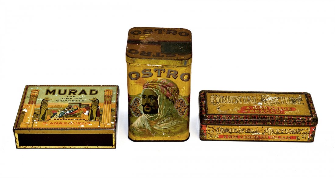 Murad, Ostro, and Oriental Mixture Tobacco Tins: Comprises: 1.) Murad cigarette tin with hinged top. [5 3/4" W x 4 1/2" D x 1 1/2" H]. 2.) Oriental mixture tin with hinged lid. [6 5/8" W x 2 7/8" D x 1 3/4" H]. 3.) Ostro cigar tin with square compre