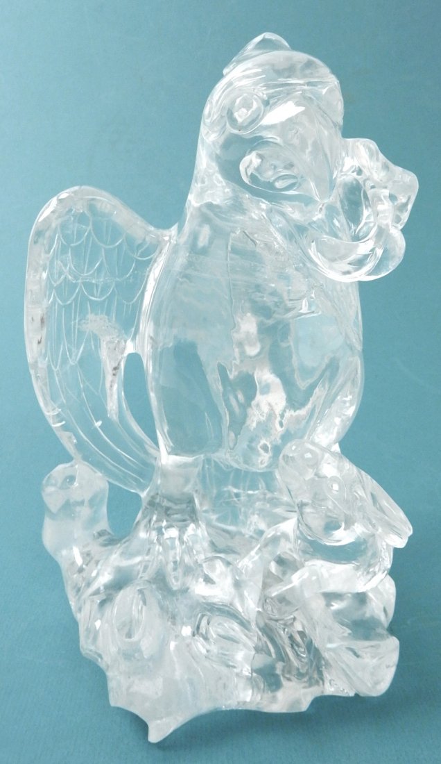 Chinese Rock Crystal Falcon & Rabbit: Chinese carved rock crystal sculpture of a falcon and a rabbit. [9 1/2" H x 6 1/2" x 6"]. Bears internal fractures characteristic with rock crystal.