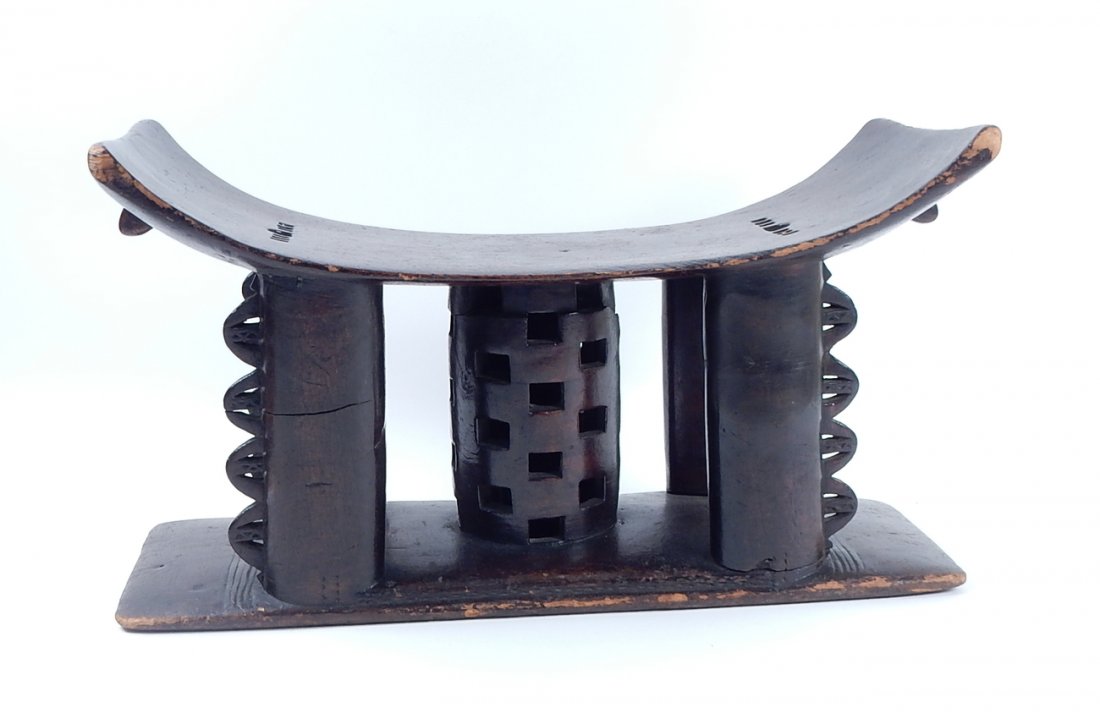 African Wood Stool: African wood seat/stool with cylindrical base. [17 1/4" W x 8" D x 10" H]. Good condition.