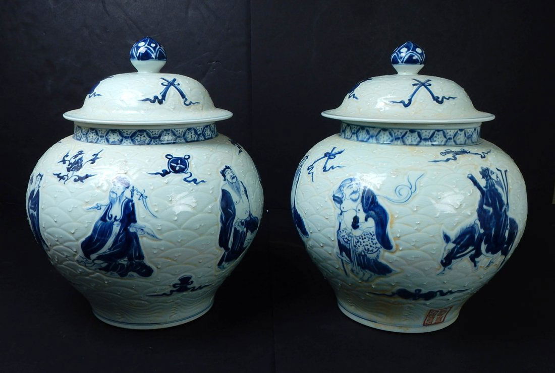 2 Large Blue & White Ginger Jars: Two porcelain covered ginger jars bearing figurative motif. [16 1/4" H x 12 1/2" Dia]. Good condition.