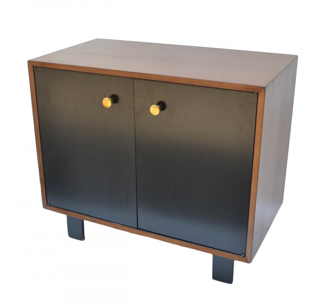 George Nelson Two Door Cabinet: George Nelson cabinet, mid-century label inside "George Nelson Design Herman Miller". Walnut with ebonized doors. [34" W x 18 1/2" D x 29 3/4" H].