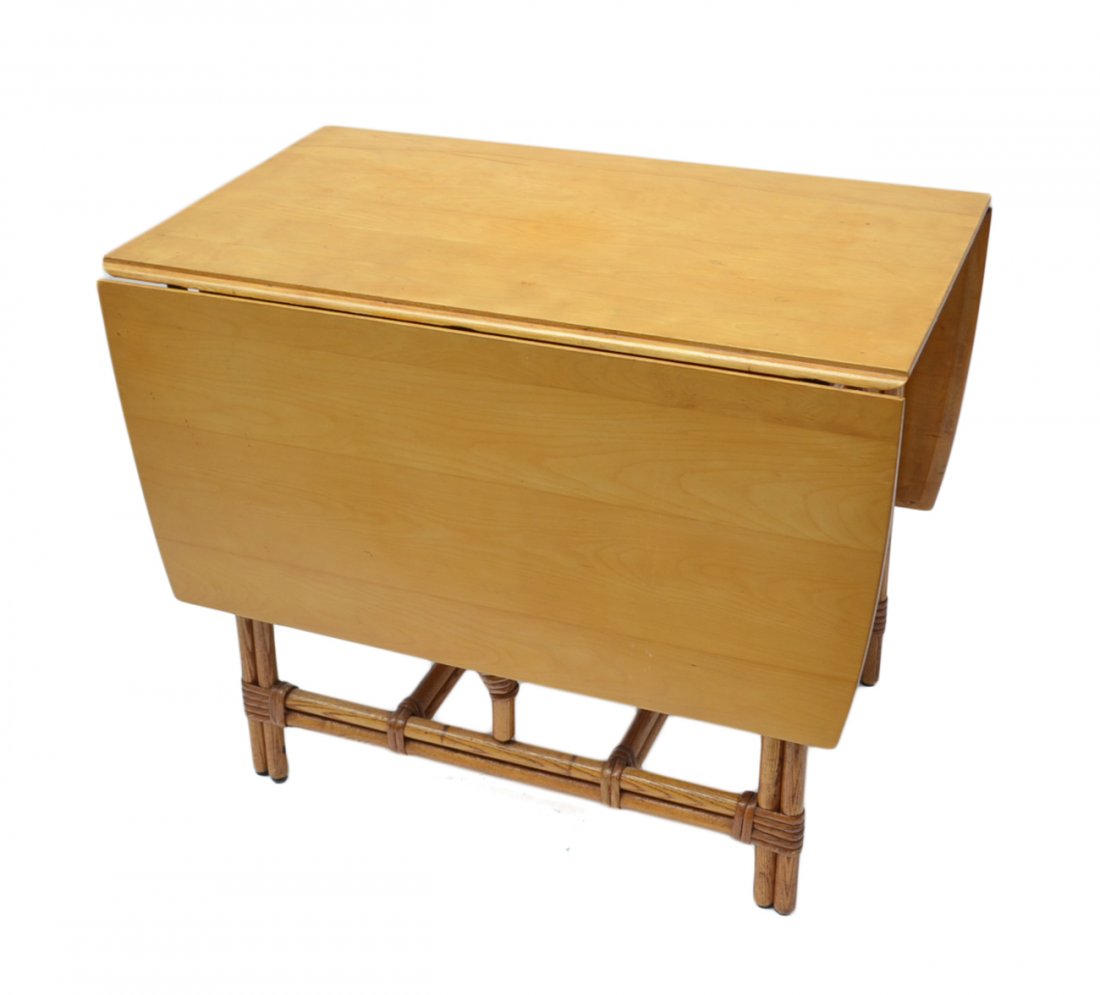 Drop-Leaf Table: Pine and rattan drop-leaf breakfast table. [21" W (65" W when open) x 36" D x 29" H]. Very good condition.