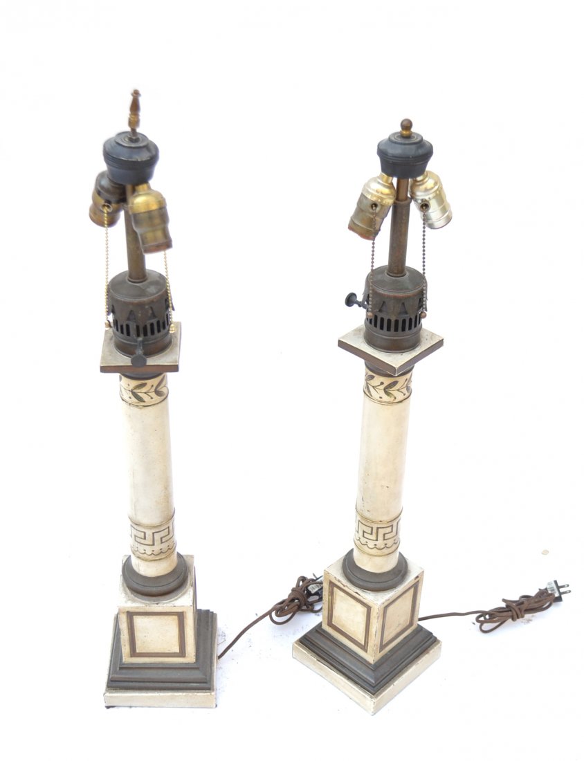 Pair of Tole Lamps: Pair of white painted tole and brass lamps. Paneled base. [6" W x 6" D x 30" H]. Minor chips to paint. Overall good condition.