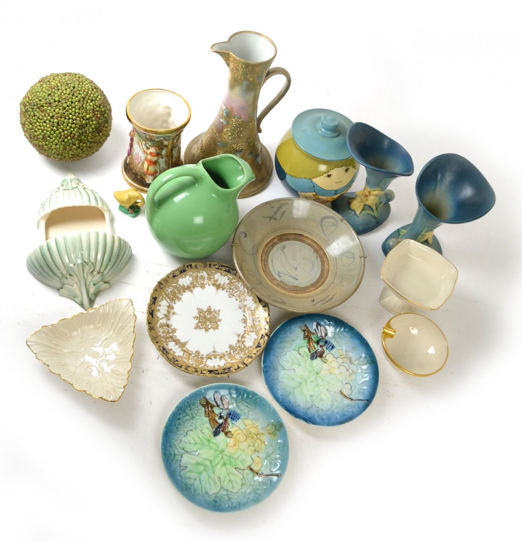 Group of Ceramic and Porcelain Articles: Miscellaneous group of 14 articles including a pair of Roseville vases, four plates, cookie jar, pieces of Lenox. Overall good condition.