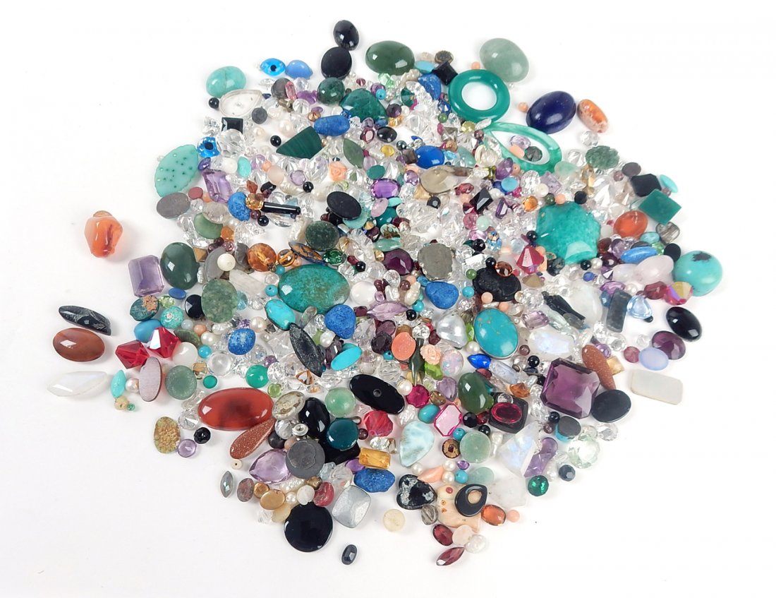 Assorted Semi-Precious Stones: Comprises: pendants, cabochons, beads, and diamond-cut stones. Includes: jade, amethyst, carnelian, lapis, turquoise, and others. Sizes from 1/8" W to 1 3/8" W. Contains several dozen specimens.