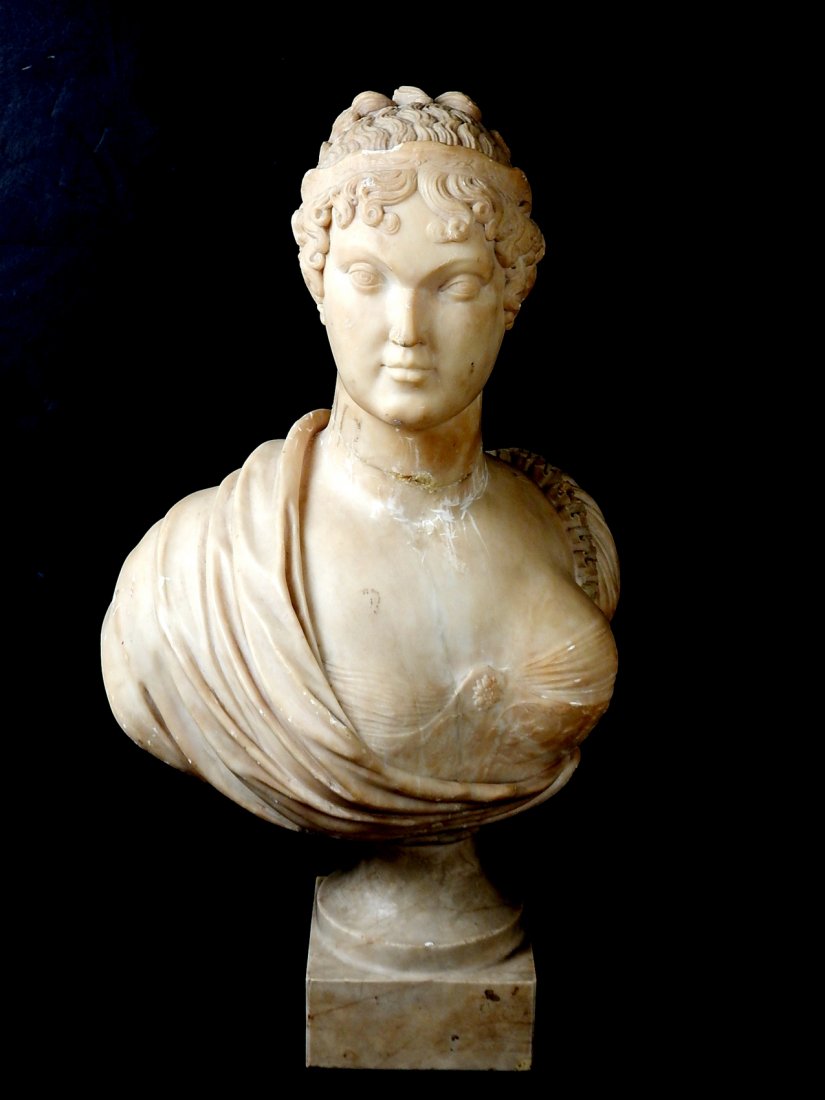 Alabaster Bust - Aristocratic Woman: Alabaster bust. Well-carved sculpture of a woman. On base. [Overall with base: 12 1/2" W x 20 1/4" H; Base: 4 1/2" W x 4 1/2" L x 5 1/2" H]. Repaired at neck. Sold "as is."