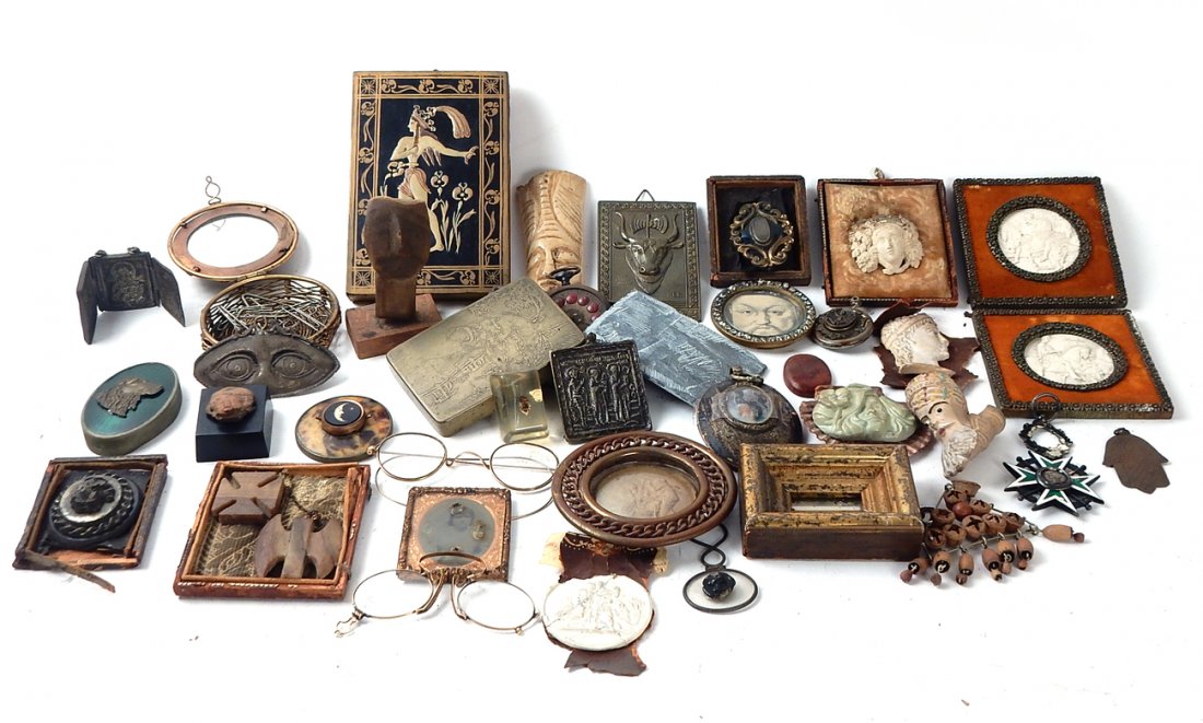 20+ Misc. Small & Decorative Objects: Comprises: Small plaster casts on frames; small museum reproductions and other objects. All sold together "as is".