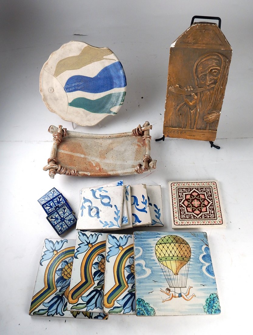16 Tiles and Other Items: Comprises: 13 tiles [8" Sq to 2 3/4" Sq], 1 pottery plate [10 1/2"], 1 plaster plaque [13" 3/4"], 1 stoneware serving dish [14" x 8"]. Good condition.