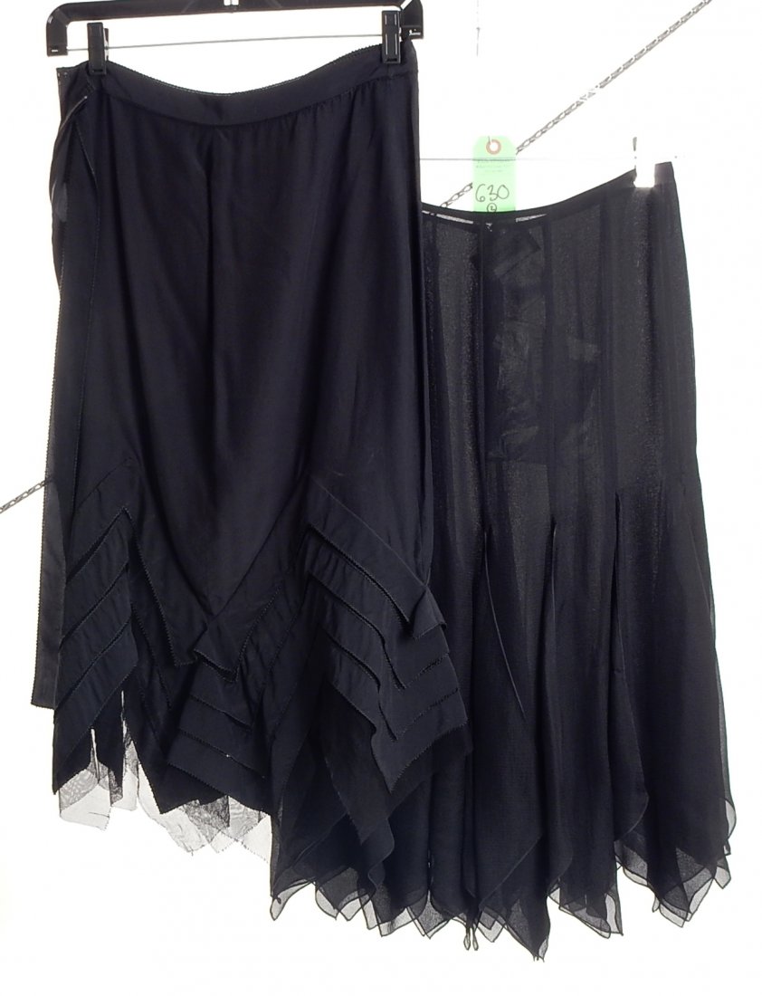 Two Silk Skirts, Yves St. Laurent/Chanel: 1.) Yves St. Laurent. Black, silk. Size 38. Good condition. 2.) Chanel. Black, silk. Size 40. Good condition.