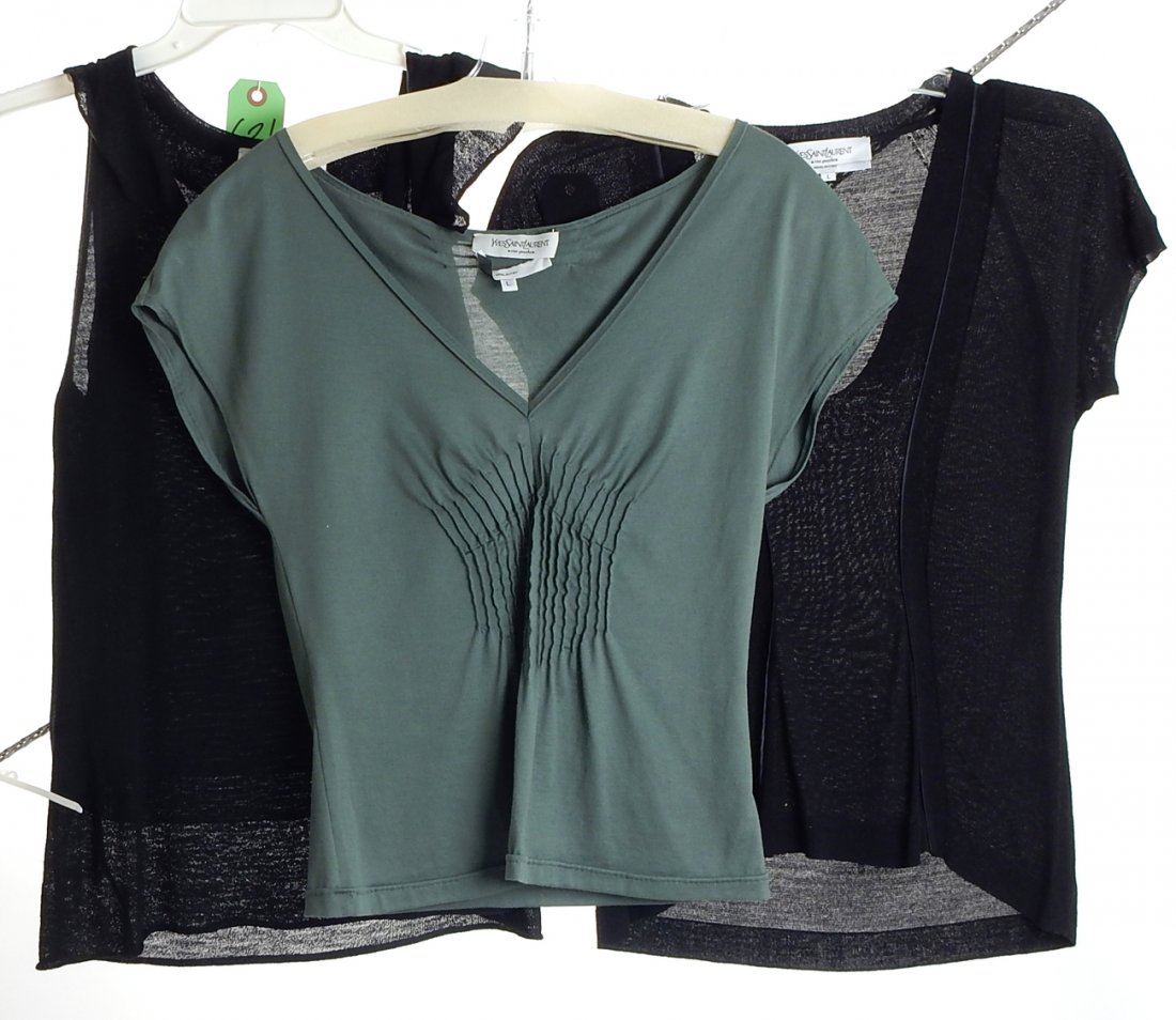 Three Yves St. Laurent Women's Shirts: 1.) Two black shirts (one large, one medium). Good condition. 2.) One green shirt, pleated middle. Large. Good condition.