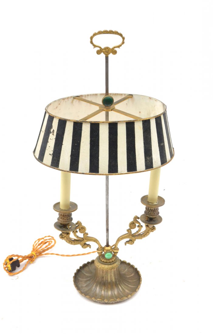 Bronze Bouillotte Lamp: Bronze base with black and white striped shade, lotus leaf base. [Base: 6 7/8" Dia; Base to top: 24 1/4" H; Shade: 10" W x 5 3/4" D x 4" H]. Wear to shade.