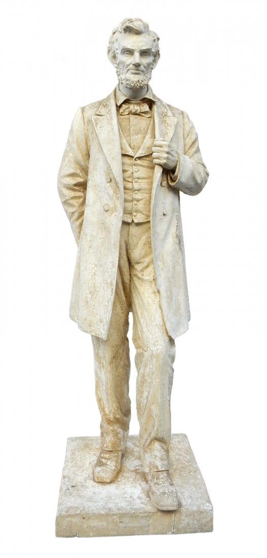 After A. Saint-Gaudens, Lincoln Statue: Larger than life size cast composition depiction of "The Great Liberator" in a full-length standing post with proper left hand clutching his lapel. Back side of base is inscribed "19...9 / Boston Scul