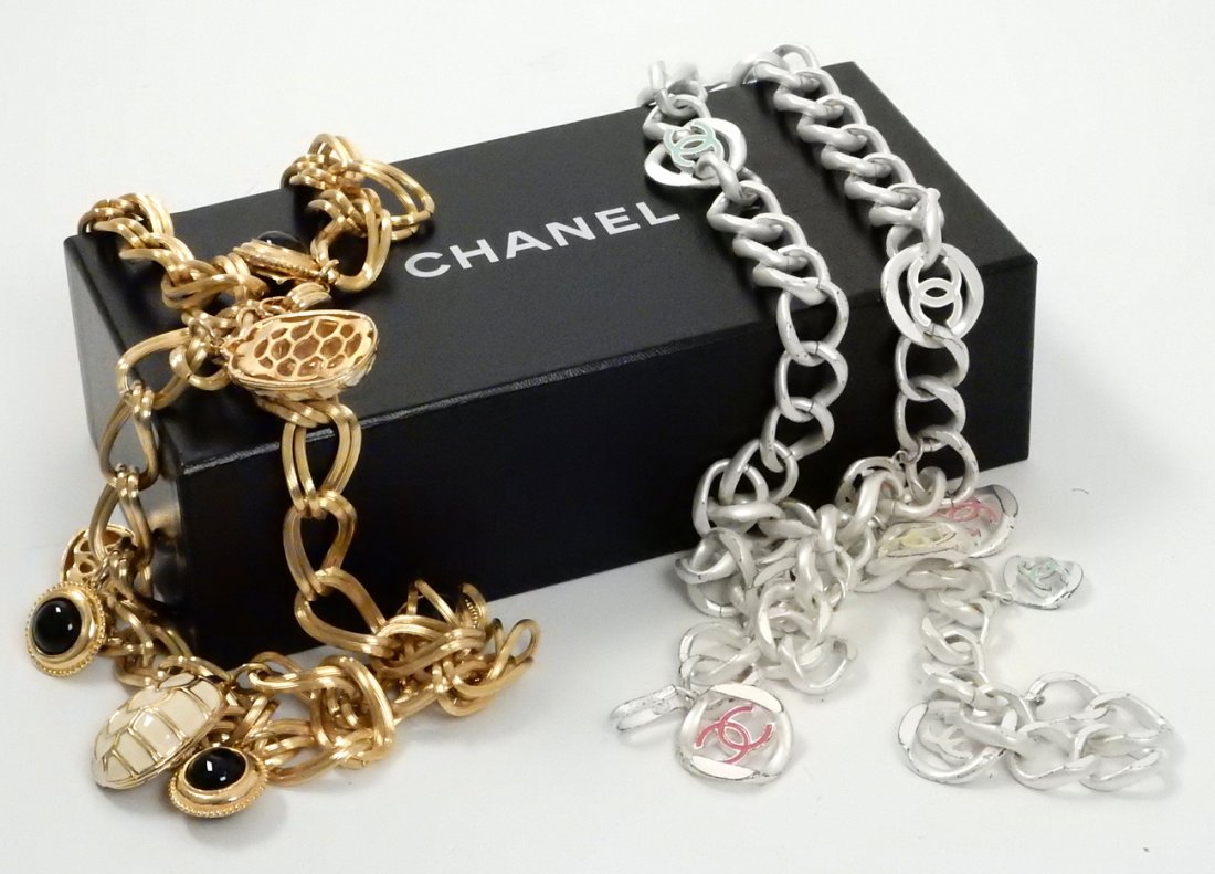 Two Belts, Chanel and Judith Lieber: 1.) Judith Lieber gold chain belt for dress, with white and black turtle shell pendants, and gold trimmed black glass cabochon. 2.) Chanel silver-tone chain link belt bearing yellow, white, pink and g