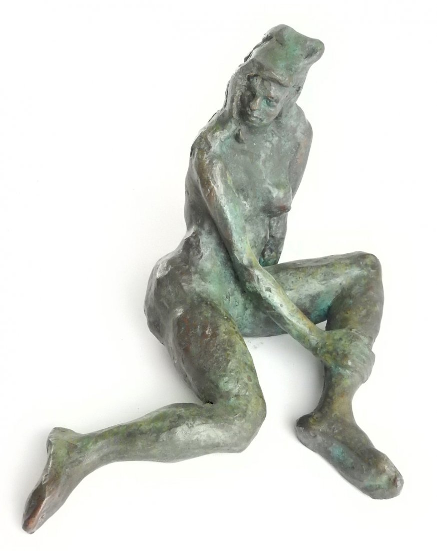 Modern Bronze Seated Female Nude: Depicts a seated female nude with legs bent and proper right hand resting on left calve. Unsigned. Bears mottled brown and green patina. [9 1/8" W x 7 3/4" D x 6 1/2" H]. From Martin Parker / Spencert