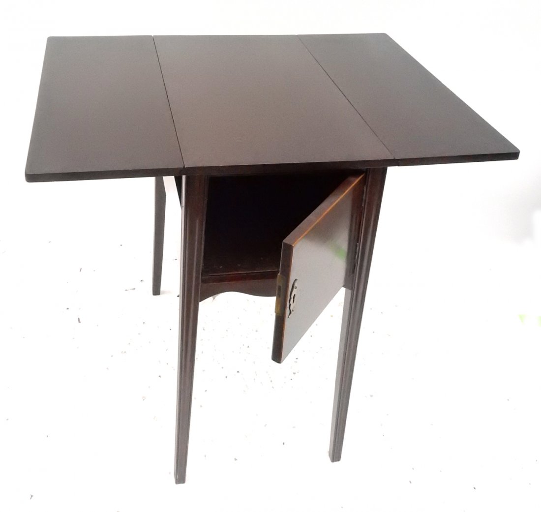 Mahogany Drop Leaf Side Table: Mahogany drop leaf side table with door and tapered legs. [14" W x 24 1/4" D x 29" H; 31" W fully extended]. Good condition with scuff marks.